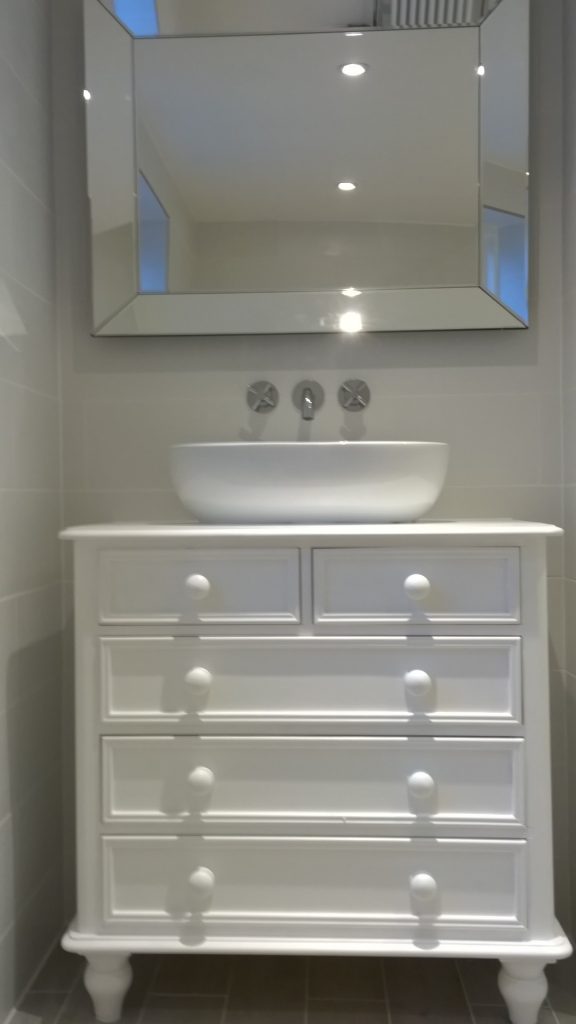Vanity unit made out of a recliamed set of drawers with a counter top basin